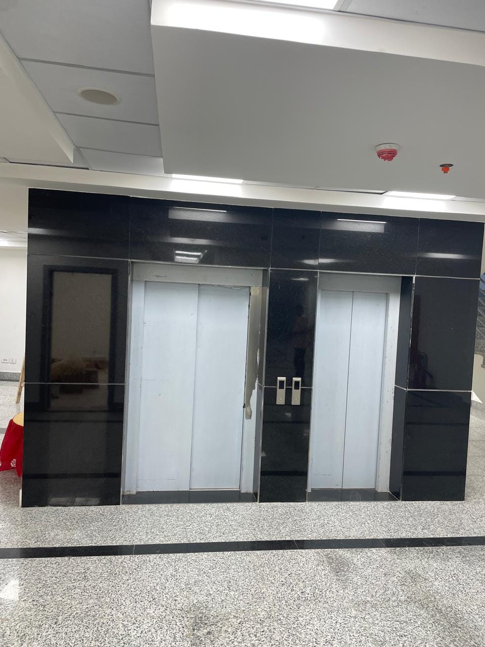 Elevator wall cladding — polished black granite