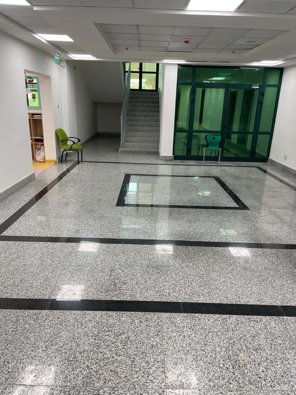 Lobby flooring with black granite borders