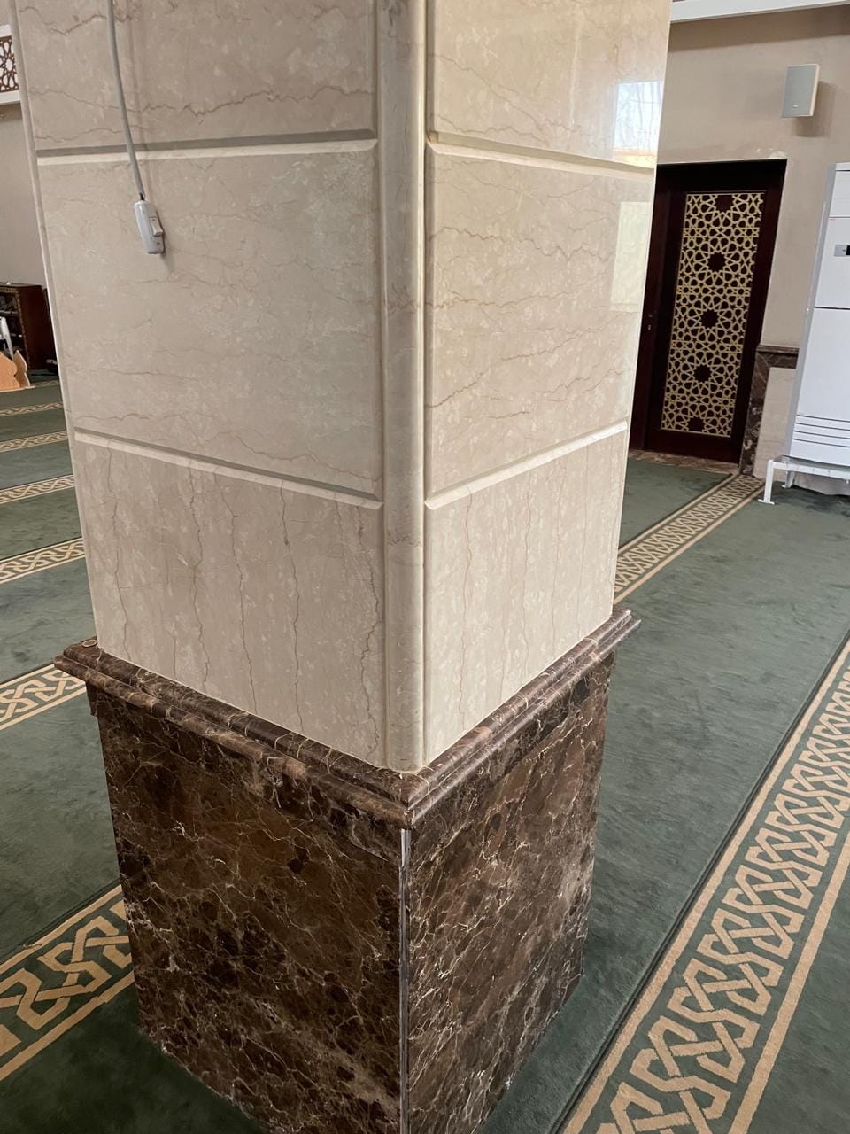 Mosque column — cream marble on an Emperador base