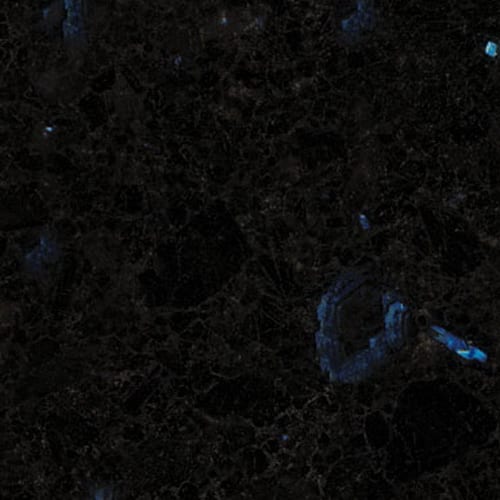 Antic Blue granite slab face, photographed for the factory catalog — near-black grey overall.