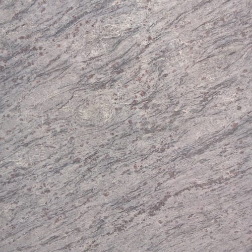Blue Valley granite slab face, photographed for the factory catalog — light grey overall.