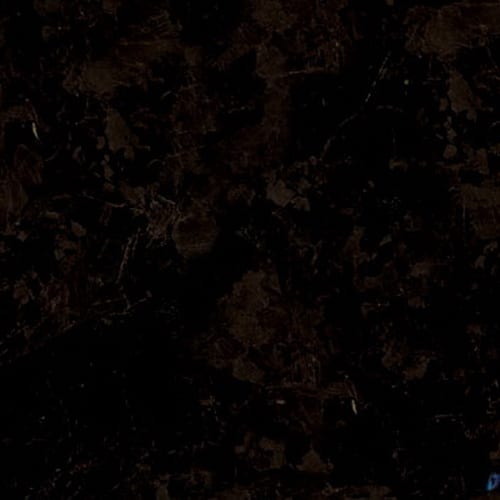 Brown Antique granite slab face, photographed for the factory catalog — near-black brown overall.