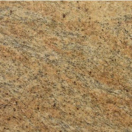 Kashmir Gold granite slab face, photographed for the factory catalog — mid-toned amber overall.