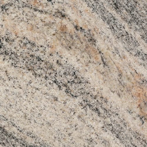 Kinwa Indiano granite slab face, photographed for the factory catalog — light warm beige overall.