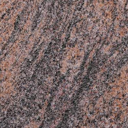 Paradiso granite slab face, photographed for the factory catalog — mid-toned red overall.