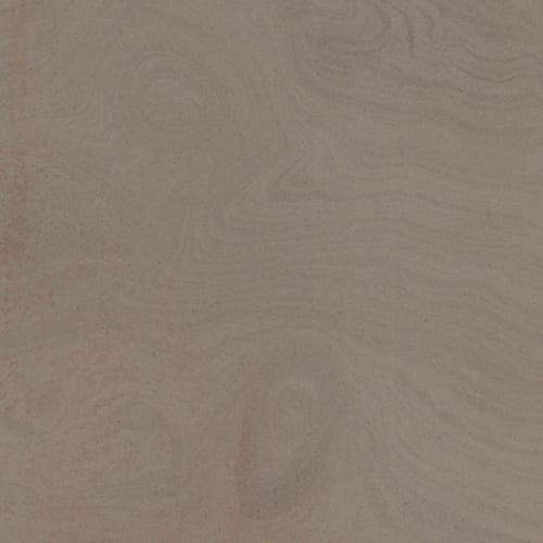 Quartize Caffe granite slab face, photographed for the factory catalog — mid-toned warm beige overall.