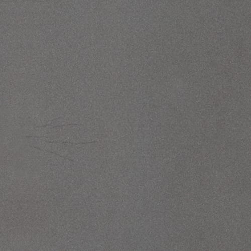 Quartize Grise granite slab face, photographed for the factory catalog — mid-toned grey overall.