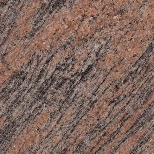 Tiger Red granite slab face, photographed for the factory catalog — mid-toned brown overall.