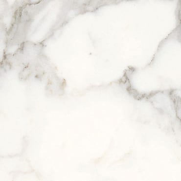 Arabescato Vagli marble slab face, photographed for the factory catalog — near-white gold overall.
