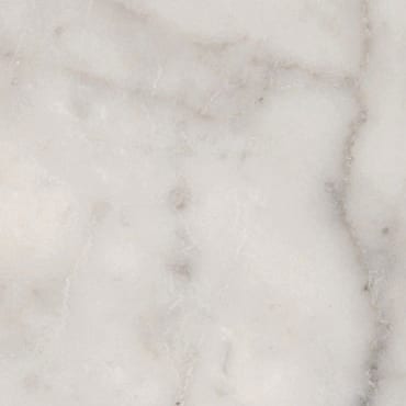 Bianco Carrara CD marble slab face, photographed for the factory catalog — light warm beige overall.