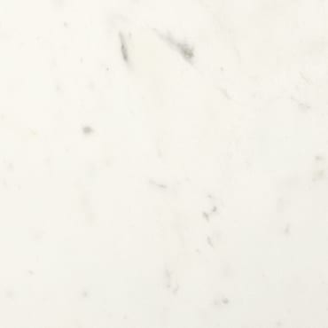 Delos Marble marble slab face, photographed for the factory catalog — near-white gold overall.