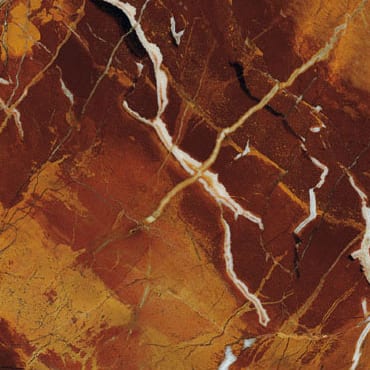 Diaspro marble slab face, photographed for the factory catalog — deep brown overall.