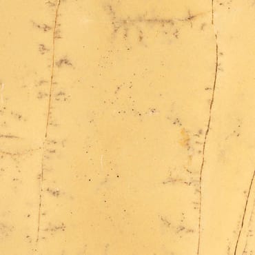 Giallo Triana marble slab face, photographed for the factory catalog — light amber overall.