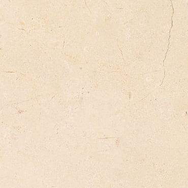 Imperial Beige marble slab face, photographed for the factory catalog — near-white amber overall.