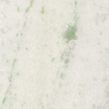 Jakarta White marble slab face, photographed for the factory catalog — near-white warm beige overall.