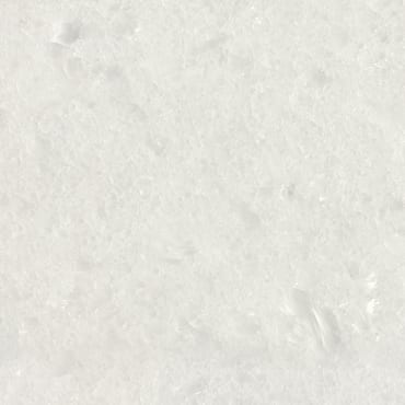 Konros Extra White marble slab face, photographed for the factory catalog — near-white warm beige overall.