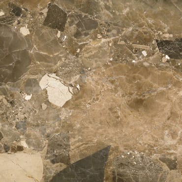Oniciato Tirreno marble slab face, photographed for the factory catalog — mid-toned amber overall.