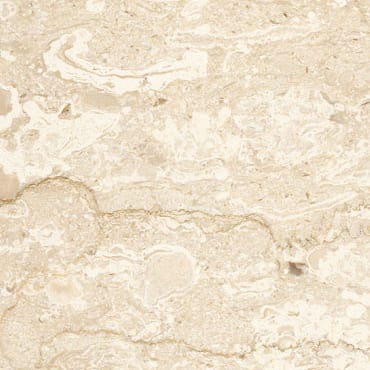 Perlato Royal marble slab face, photographed for the factory catalog — near-white amber overall.