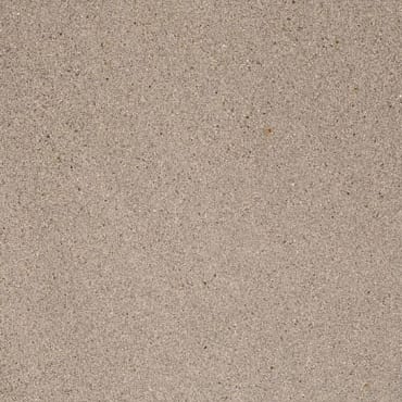 Pietra Serena marble slab face, photographed for the factory catalog — mid-toned warm beige overall.